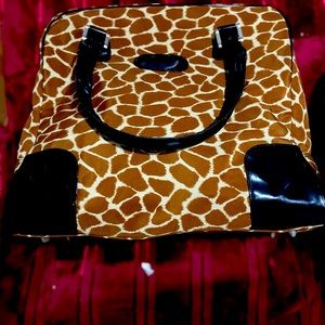 Overnight bag, camel print black handles good condition.